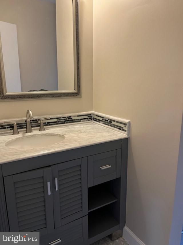 7032 Token Valley Road Manassas, VA 20112 - Photo 9 of 25 a bathroom with a sink and a mirror