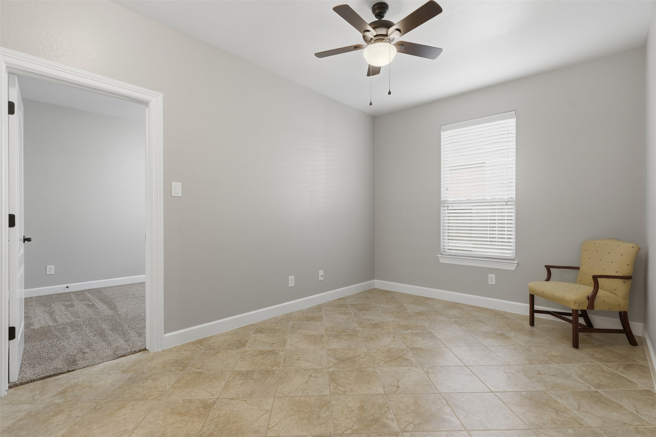 721 Rufina Street League City, TX 77573 - Photo 12 of 33 A rare bonus room offers exceptional flexibility to fit your lifestyle. Finished with durable tile flooring and a ceiling fan, this versatile space is ideal as a private study, hobby room, fitness area, craft room, media lounge, or additional living space.
