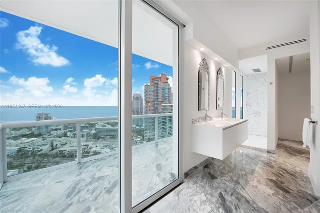 a view of a bathroom with a tub shower and sink
