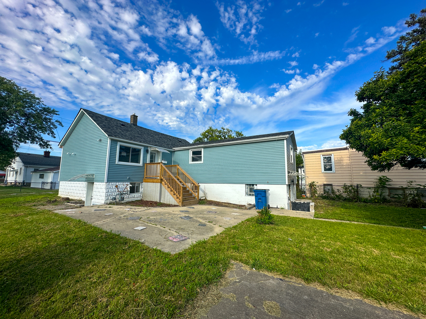 646 Frances Street Phoenix, IL 60426 - Photo 1 of 30 a view of a house with backyard and a tree