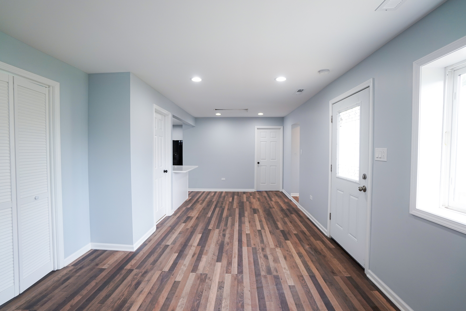 646 Frances Street Phoenix, IL 60426 - Photo 14 of 30 a view of a room with wooden floor and window
