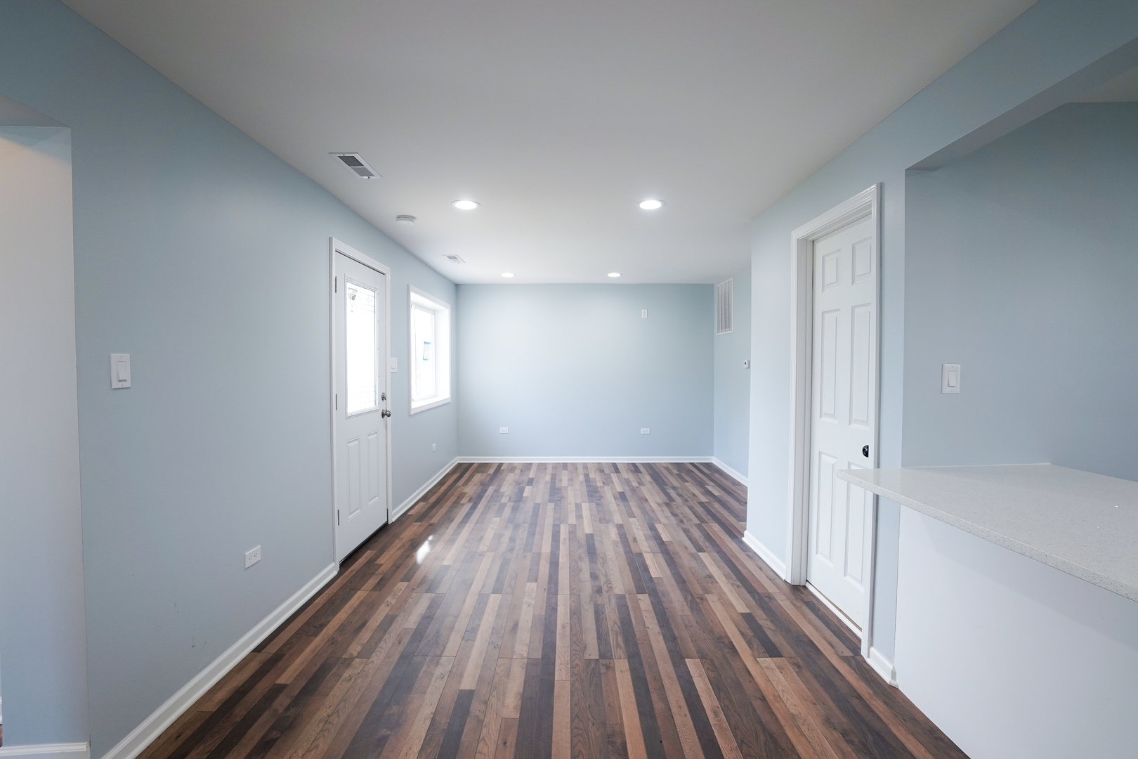 646 Frances Street Phoenix, IL 60426 - Photo 15 of 30 a view of wooden floor and chandelier in a room
