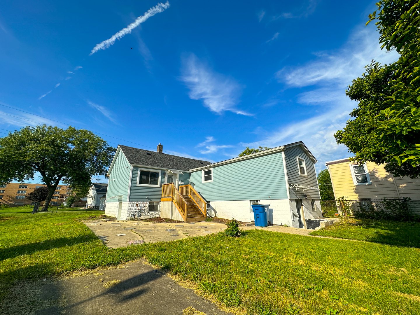 646 Frances Street Phoenix, IL 60426 - Photo 2 of 30 a view of a house with backyard and a tree