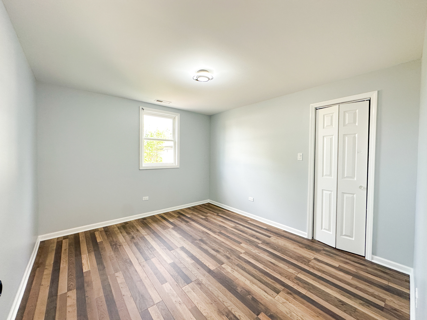646 Frances Street Phoenix, IL 60426 - Photo 23 of 30 wooden floor in an empty room with a window