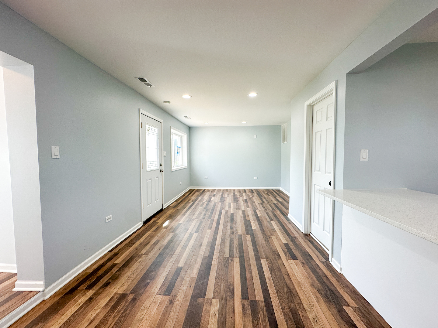 646 Frances Street Phoenix, IL 60426 - Photo 24 of 30 a view of bedroom with wooden floor and window