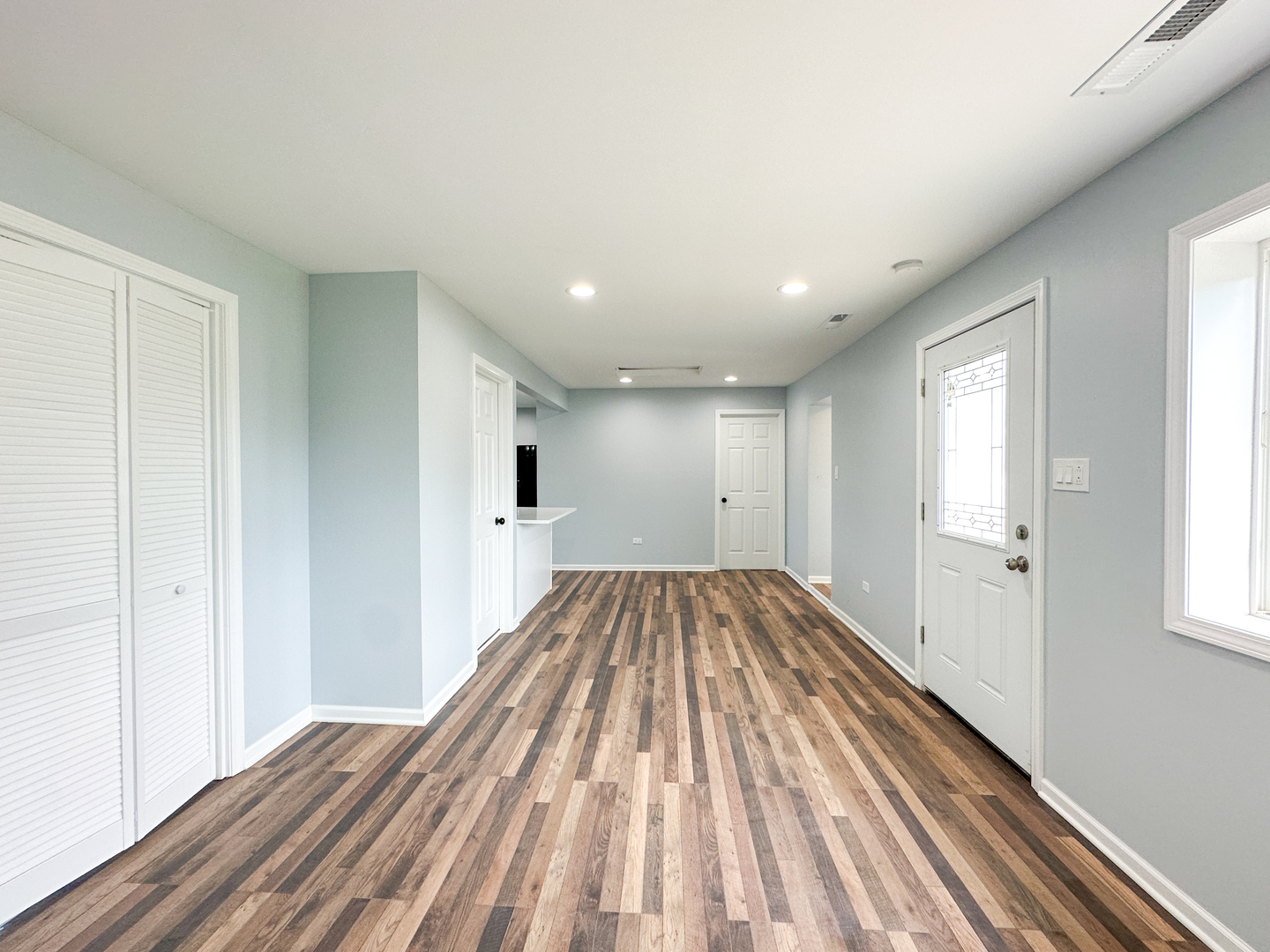 646 Frances Street Phoenix, IL 60426 - Photo 26 of 30 a view of a room with wooden floor and staircase