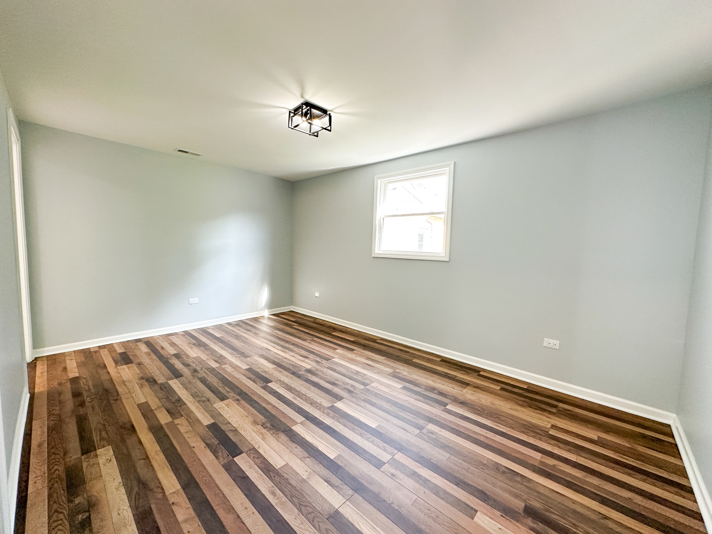 646 Frances Street Phoenix, IL 60426 - Photo 27 of 30 a view of empty room with wooden floor