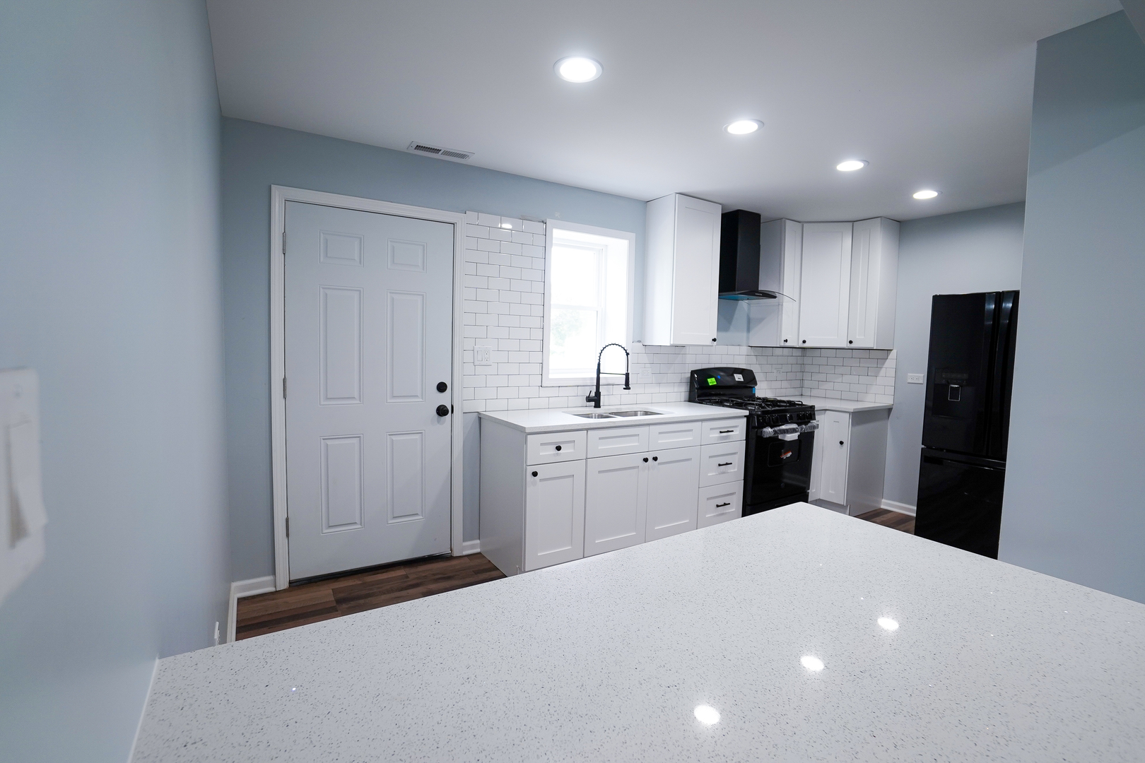 646 Frances Street Phoenix, IL 60426 - Photo 4 of 30 a kitchen with a refrigerator a sink and cabinets