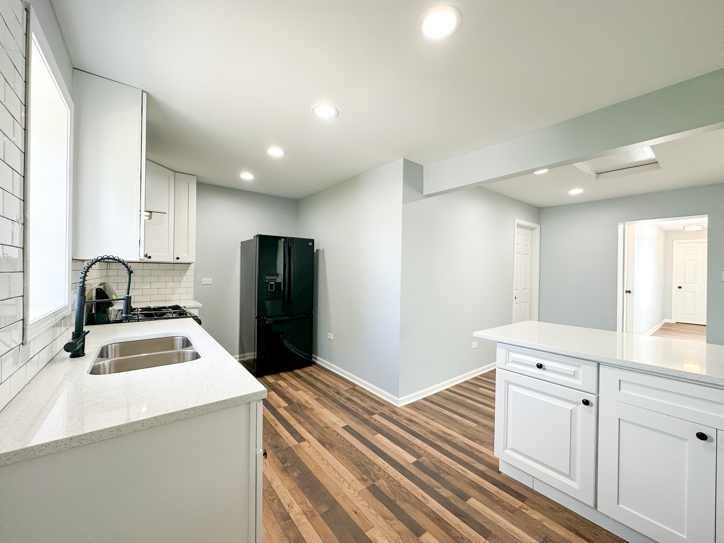 646 Frances Street Phoenix, IL 60426 - Photo 6 of 30 a kitchen with a refrigerator and a sink
