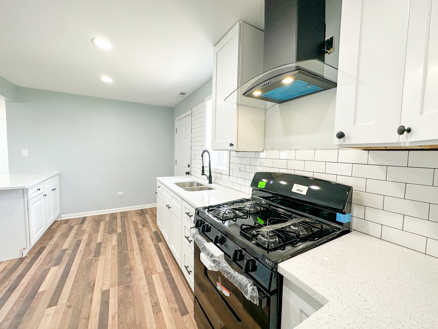 646 Frances Street Phoenix, IL 60426 - Photo 7 of 30 a stove top oven sitting inside of a kitchen
