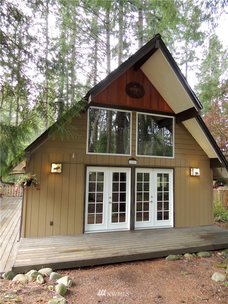 17609 Loop Lane Southeast Yelm, WA 98597 - Photo 1 of 23 a front view of a house with a yard