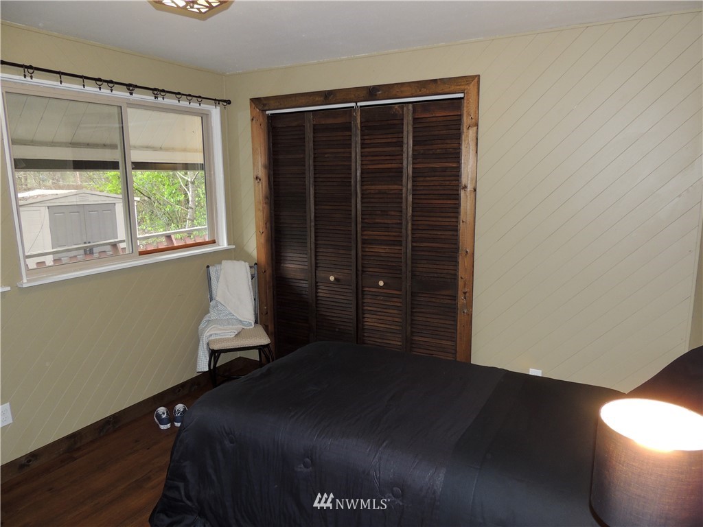17609 Loop Lane Southeast Yelm, WA 98597 - Photo 13 of 23 a bedroom with a bed and a window