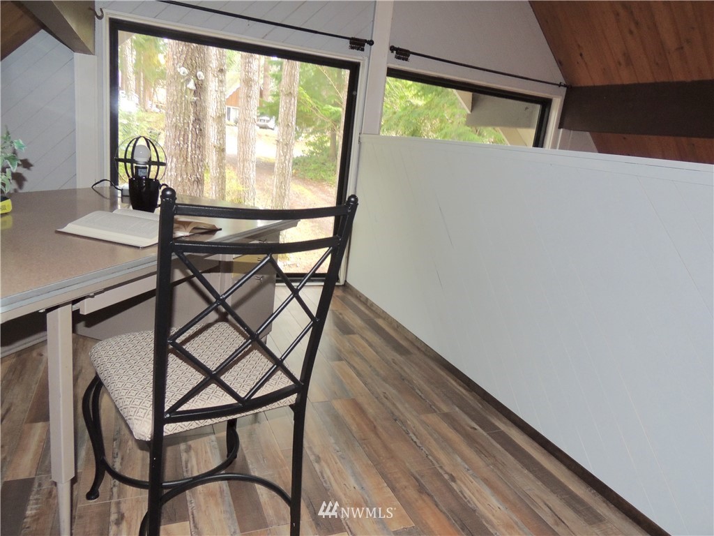 17609 Loop Lane Southeast Yelm, WA 98597 - Photo 16 of 23 a view of a room with furniture and wooden floor