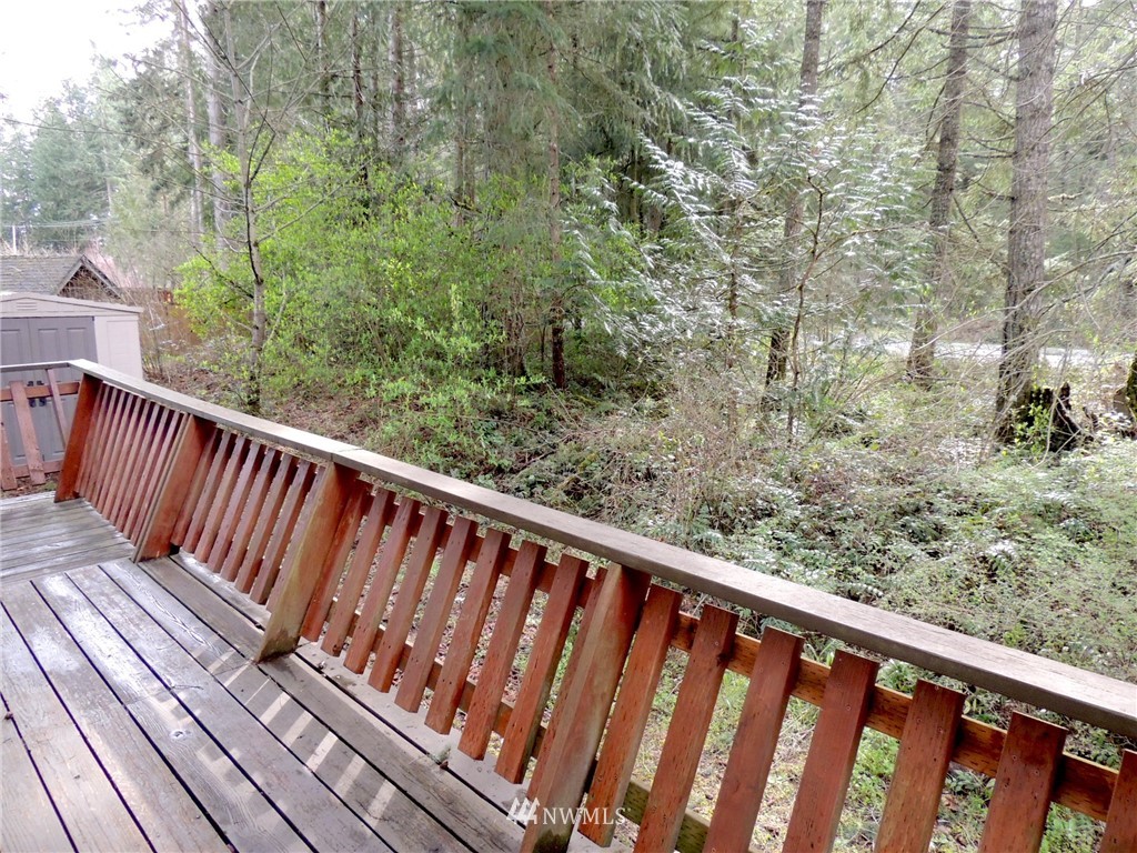 17609 Loop Lane Southeast Yelm, WA 98597 - Photo 21 of 23 a view of balcony with wooden floor