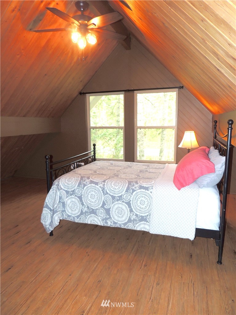 17609 Loop Lane Southeast Yelm, WA 98597 - Photo 10 of 23 a bedroom with a bed and window