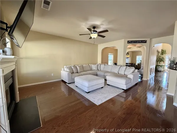 a living room with furniture and a fireplace