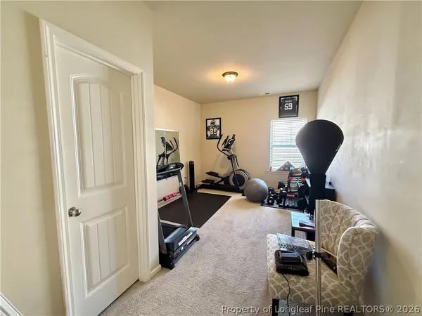 a room with gym equipment and a mirror