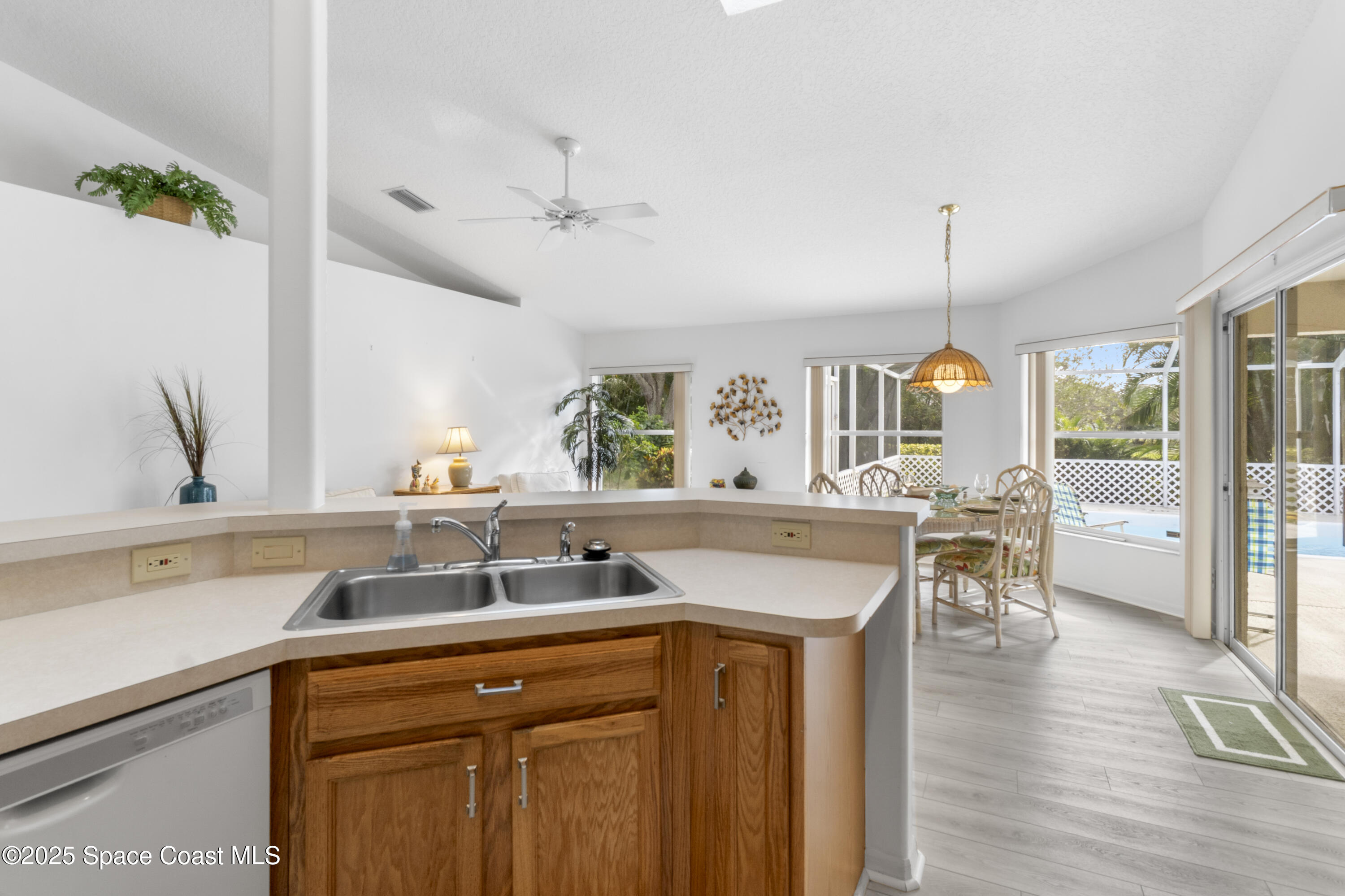 5155 3rd Manor Vero Beach, FL 32968 - Photo 11 of 29 a kitchen with a sink a counter space and stainless steel appliances