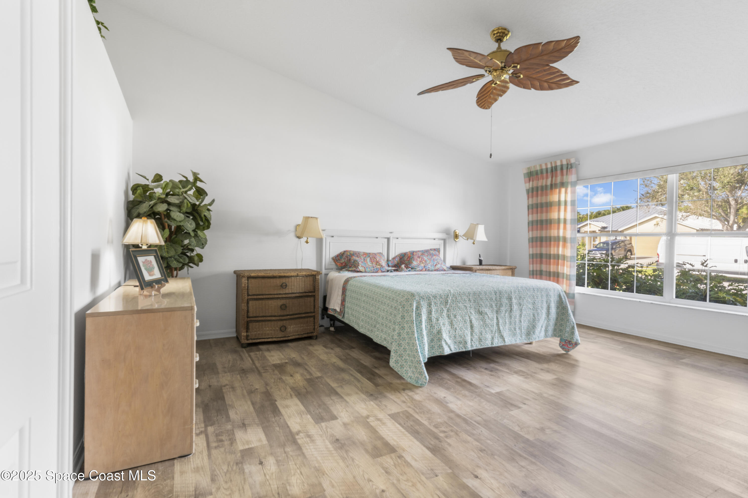 5155 3rd Manor Vero Beach, FL 32968 - Photo 15 of 29 a bedroom with a bed dresser and a window