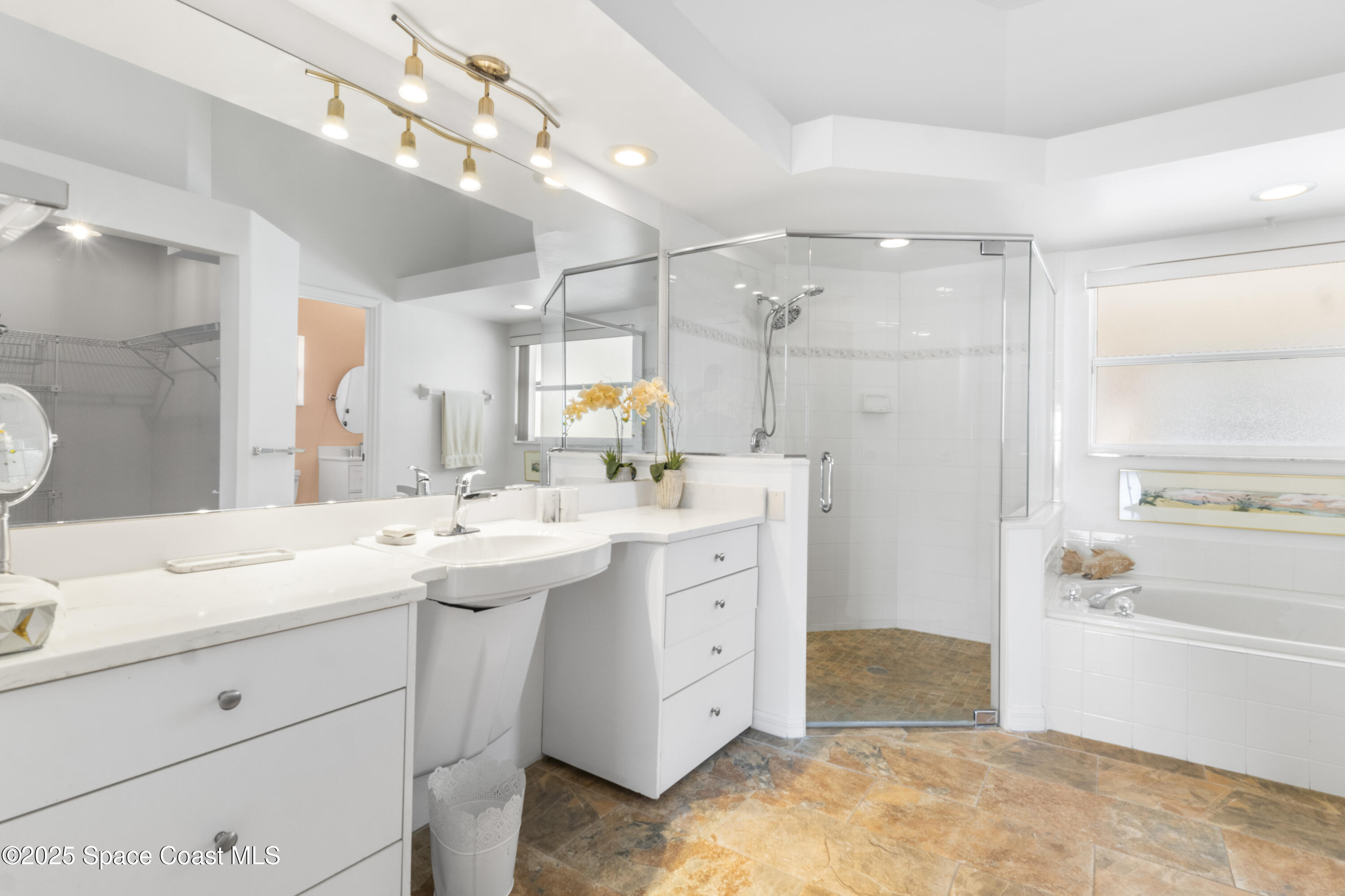 5155 3rd Manor Vero Beach, FL 32968 - Photo 18 of 29 a spacious bathroom with a sink double vanity and a mirror