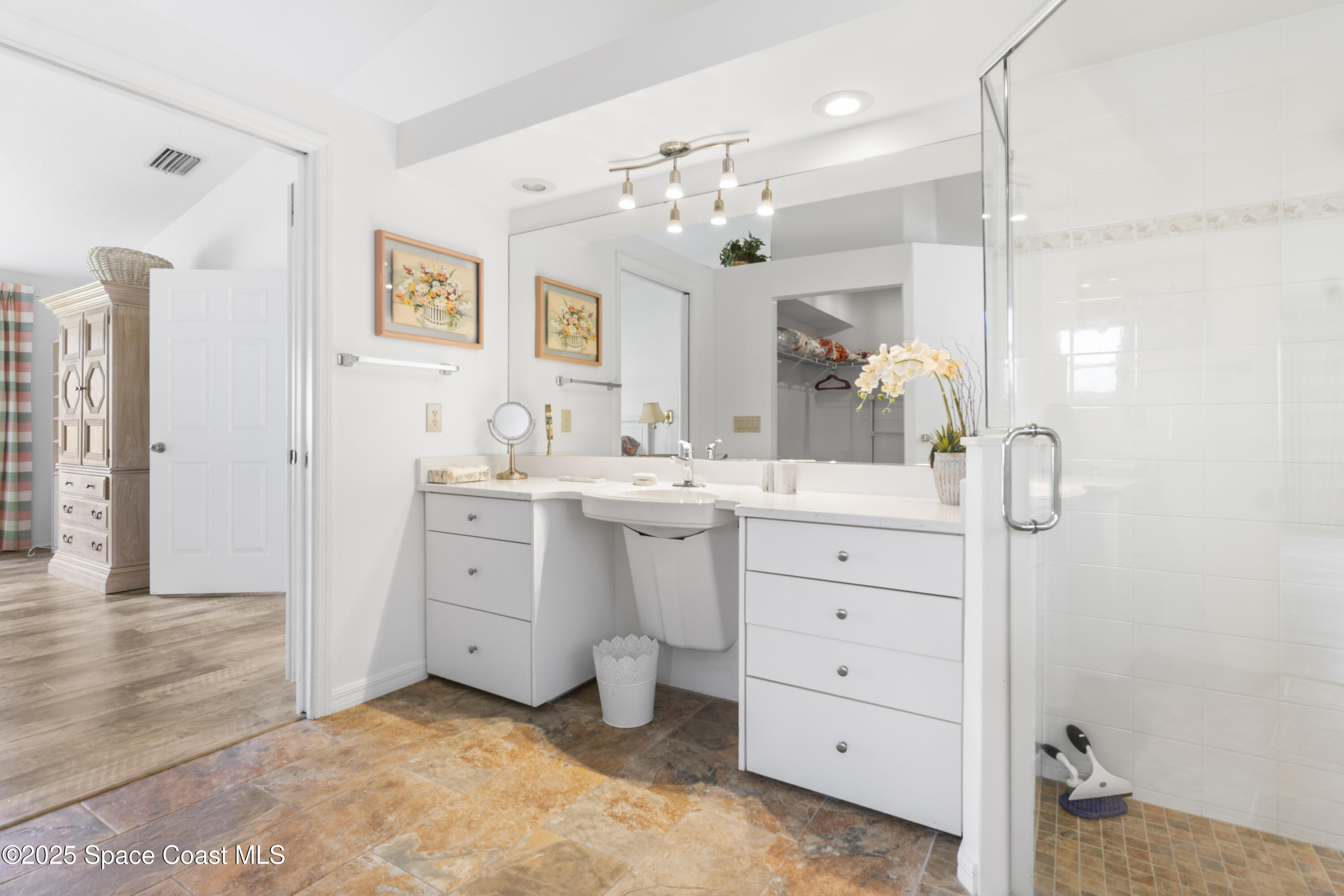 5155 3rd Manor Vero Beach, FL 32968 - Photo 19 of 29 a bathroom with a sink double vanity and a mirror
