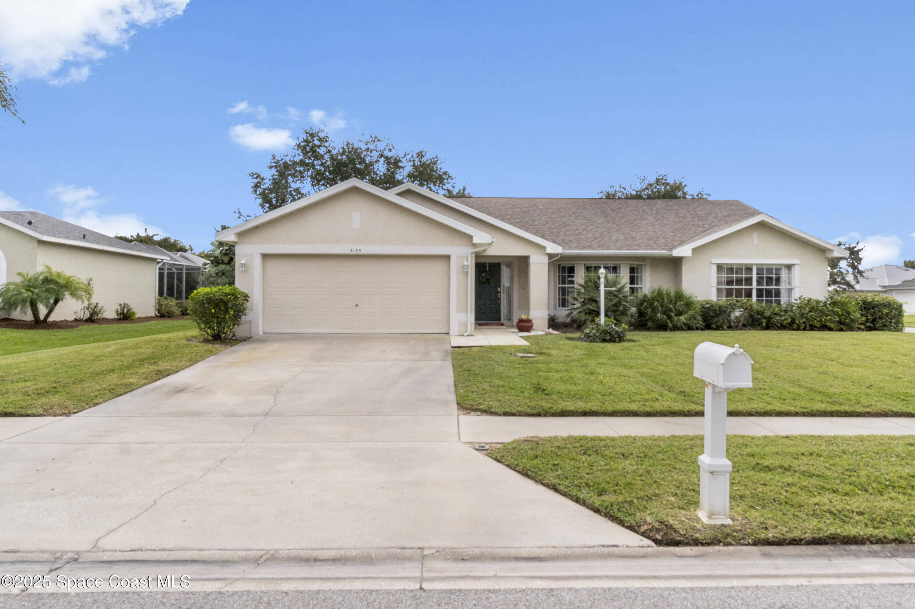 5155 3rd Manor Vero Beach, FL 32968 - Photo 2 of 29 a front view of a house with a yard
