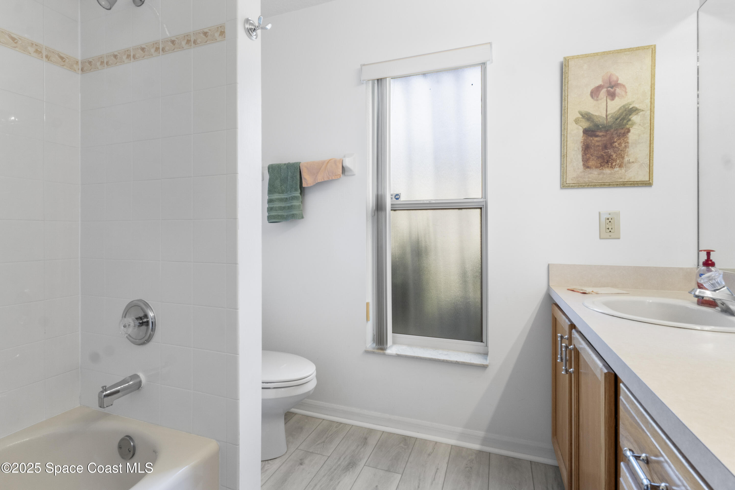 5155 3rd Manor Vero Beach, FL 32968 - Photo 22 of 29 a bathroom with a sink a toilet and shower