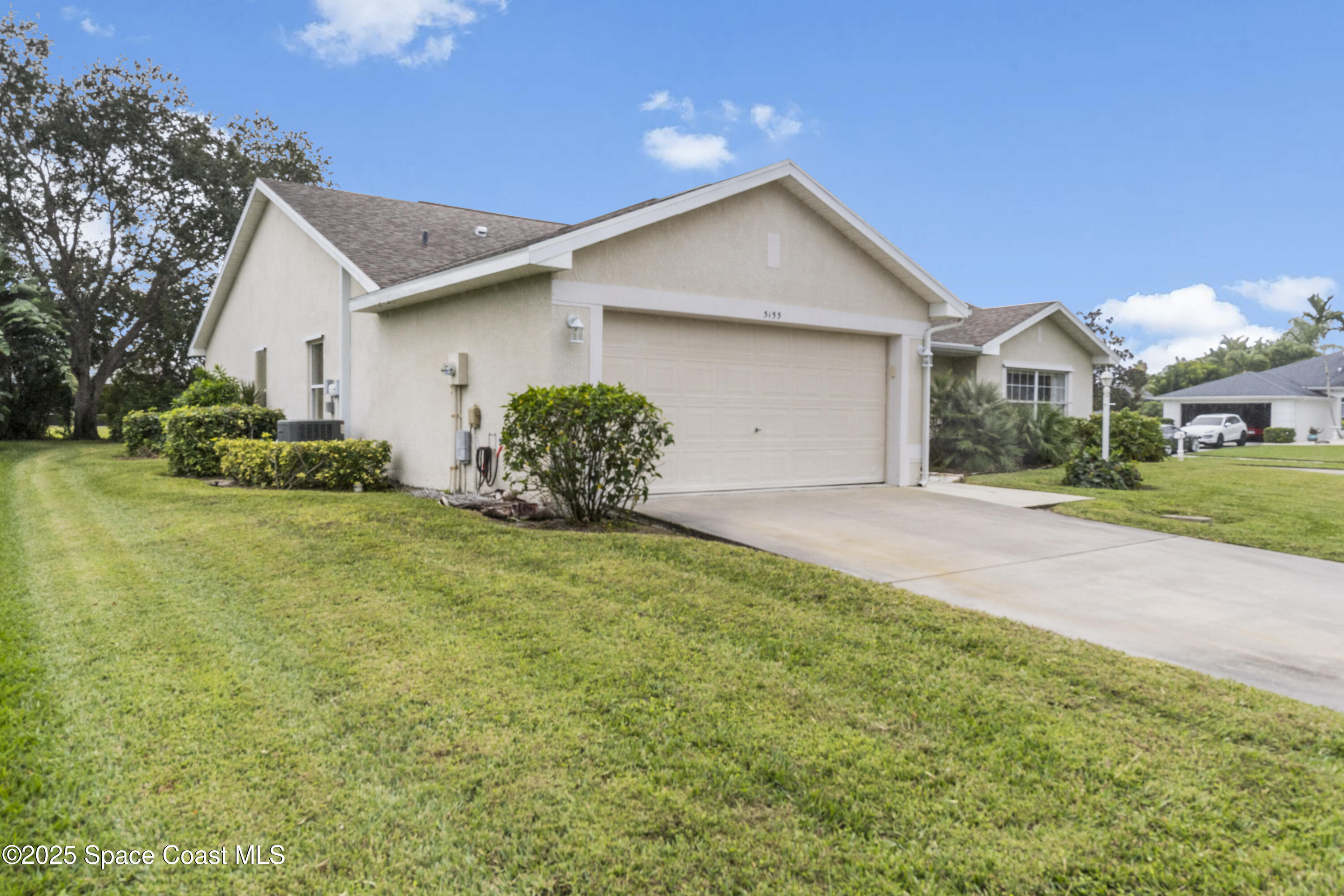 5155 3rd Manor Vero Beach, FL 32968 - Photo 3 of 29 a front view of house with yard and green space