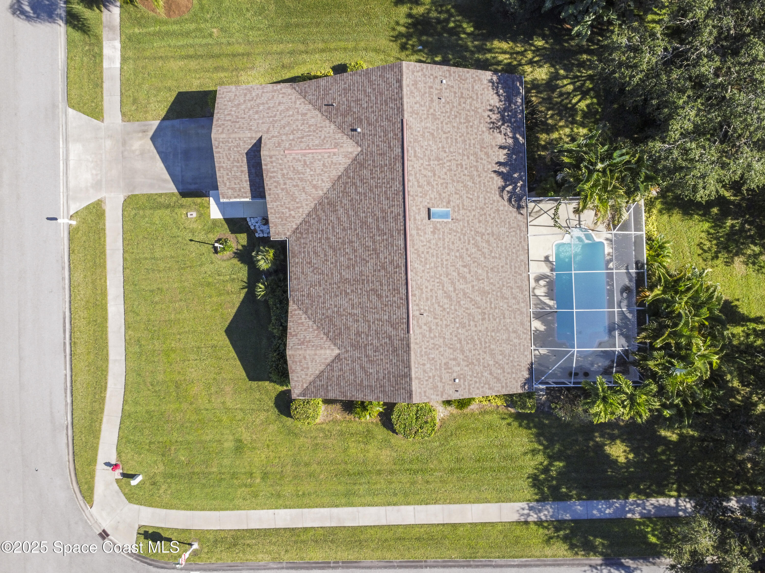 5155 3rd Manor Vero Beach, FL 32968 - Photo 4 of 29 a view of a swimming pool with a yard and seating area