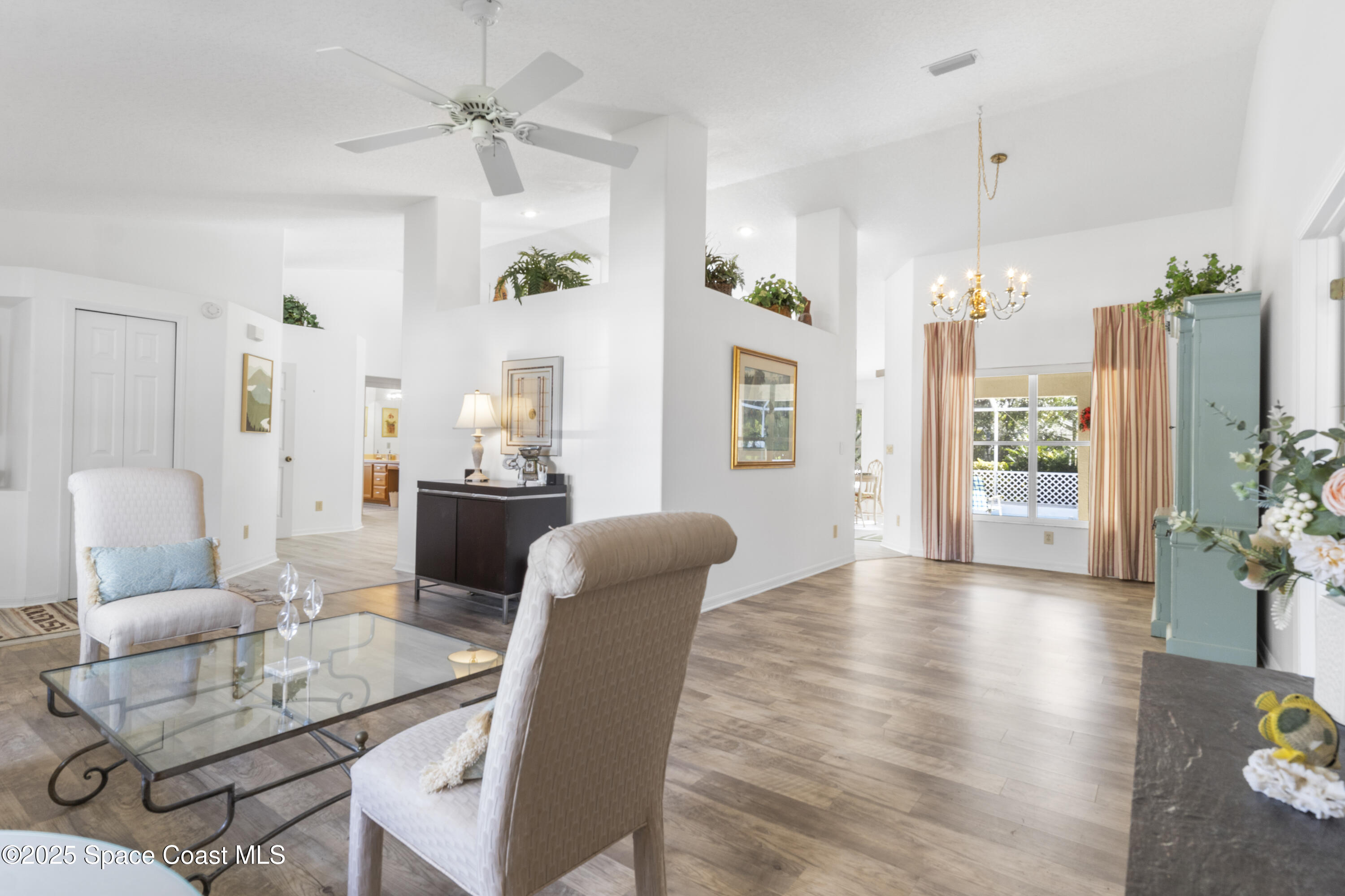 5155 3rd Manor Vero Beach, FL 32968 - Photo 8 of 29 a view of a livingroom with furniture window and wooden floor