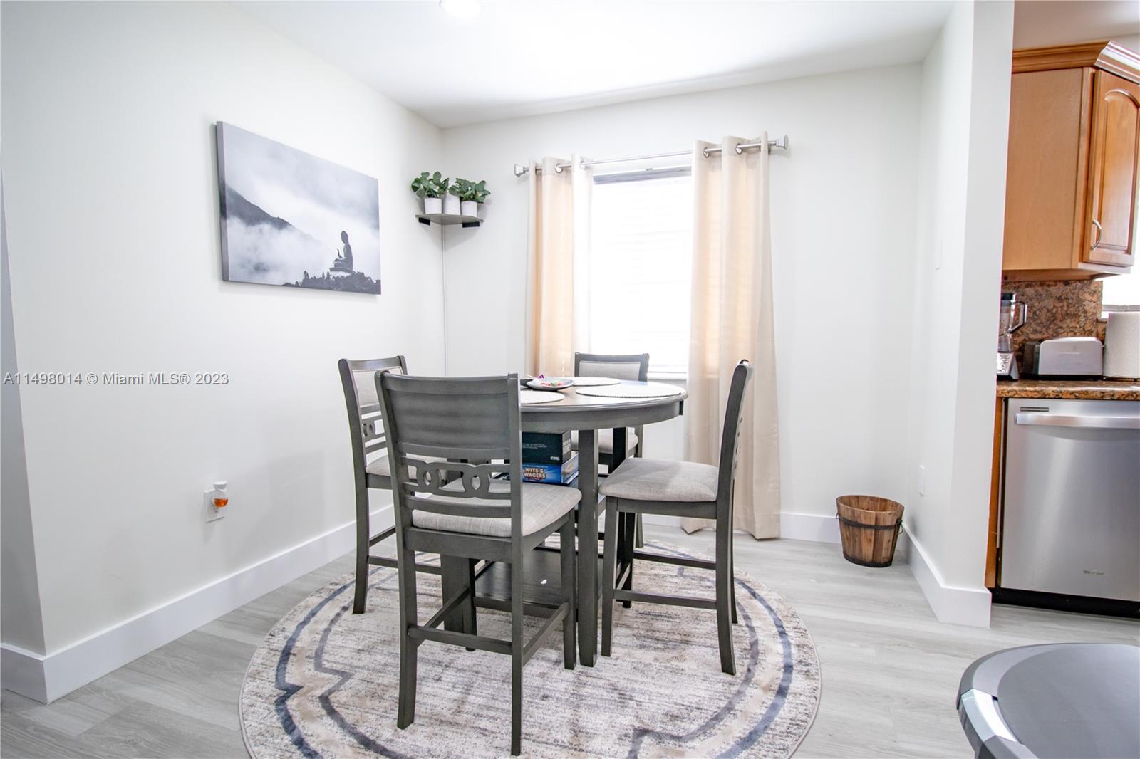 18706 Southwest 100th Avenue, Unit 18706 Cutler Bay, FL 33157 - Photo 6 of 20 a dining room with furniture and window