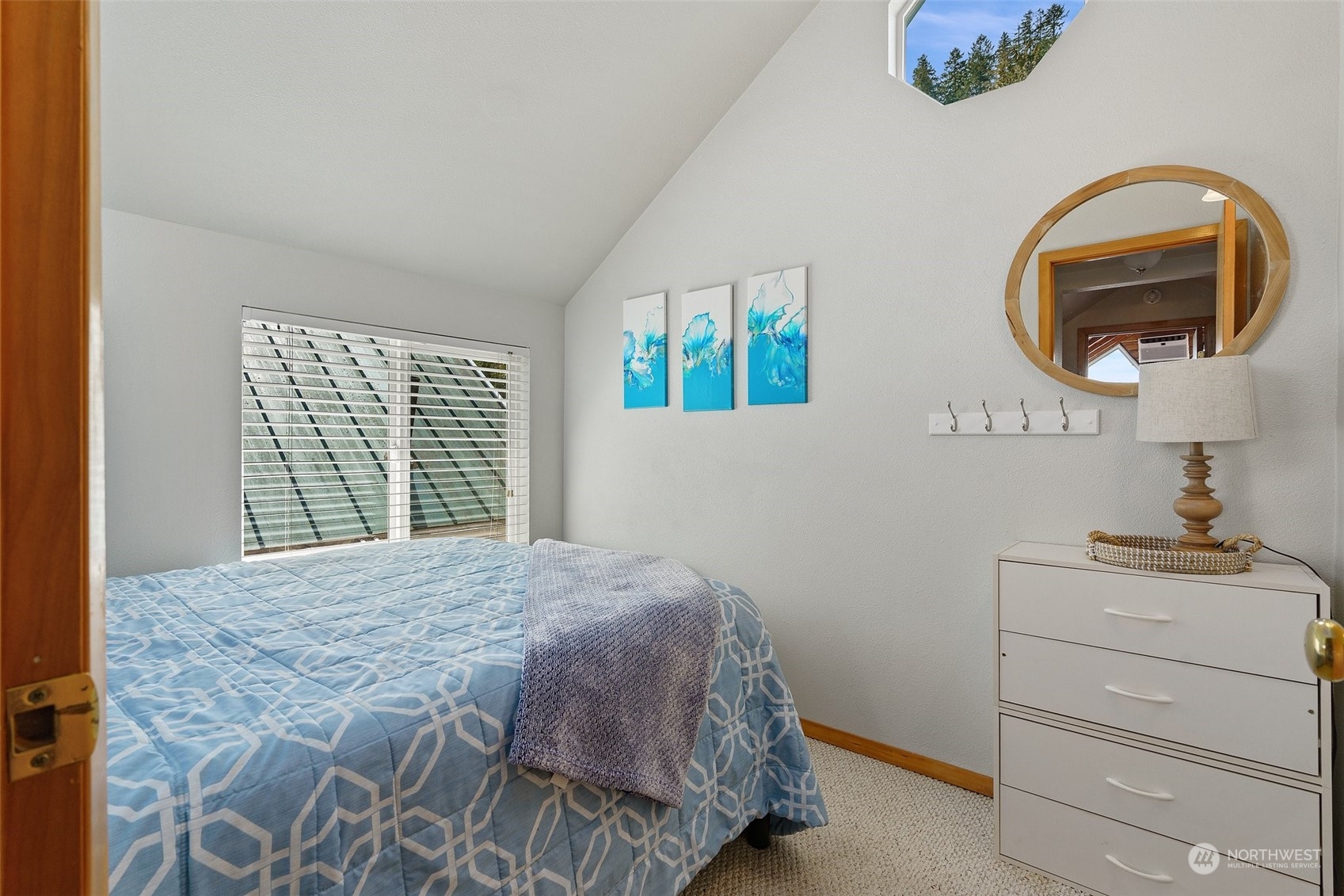 8371 Highway 106 Union, WA 98592 - Photo 11 of 29 a bedroom with a bed and a painting on the wall
