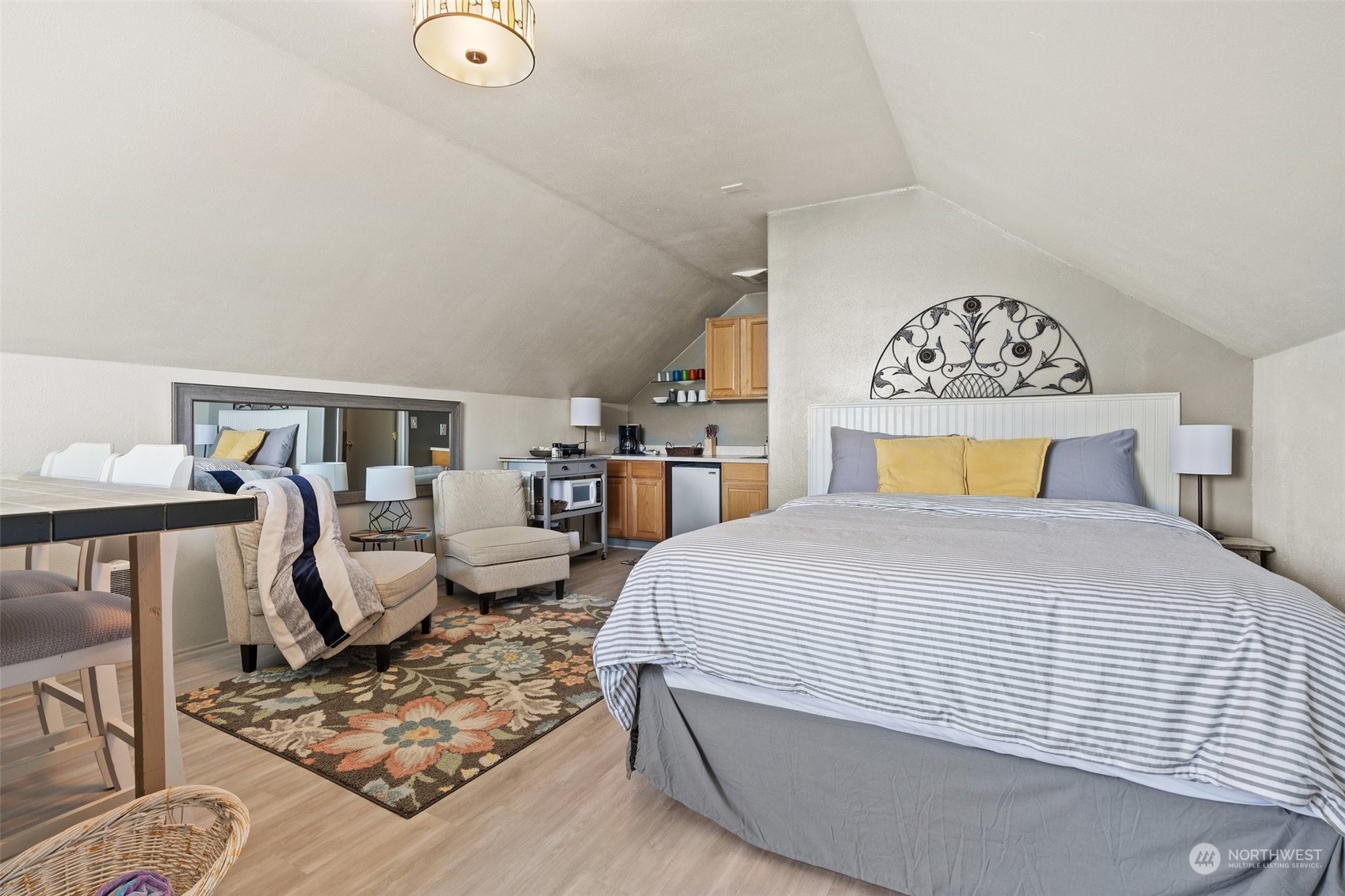 8371 Highway 106 Union, WA 98592 - Photo 15 of 29 a bedroom with a bed and wooden floor