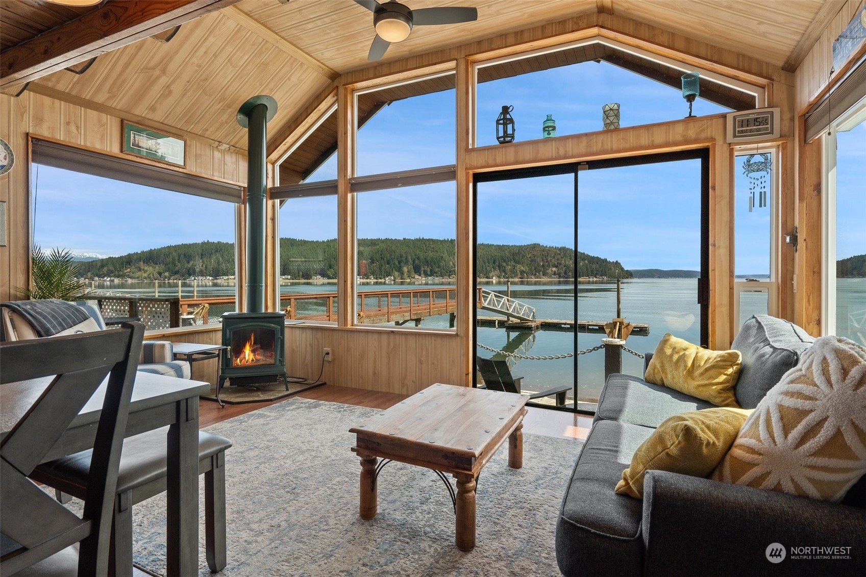 8371 Highway 106 Union, WA 98592 - Photo 3 of 29 a living room with furniture and a floor to ceiling window