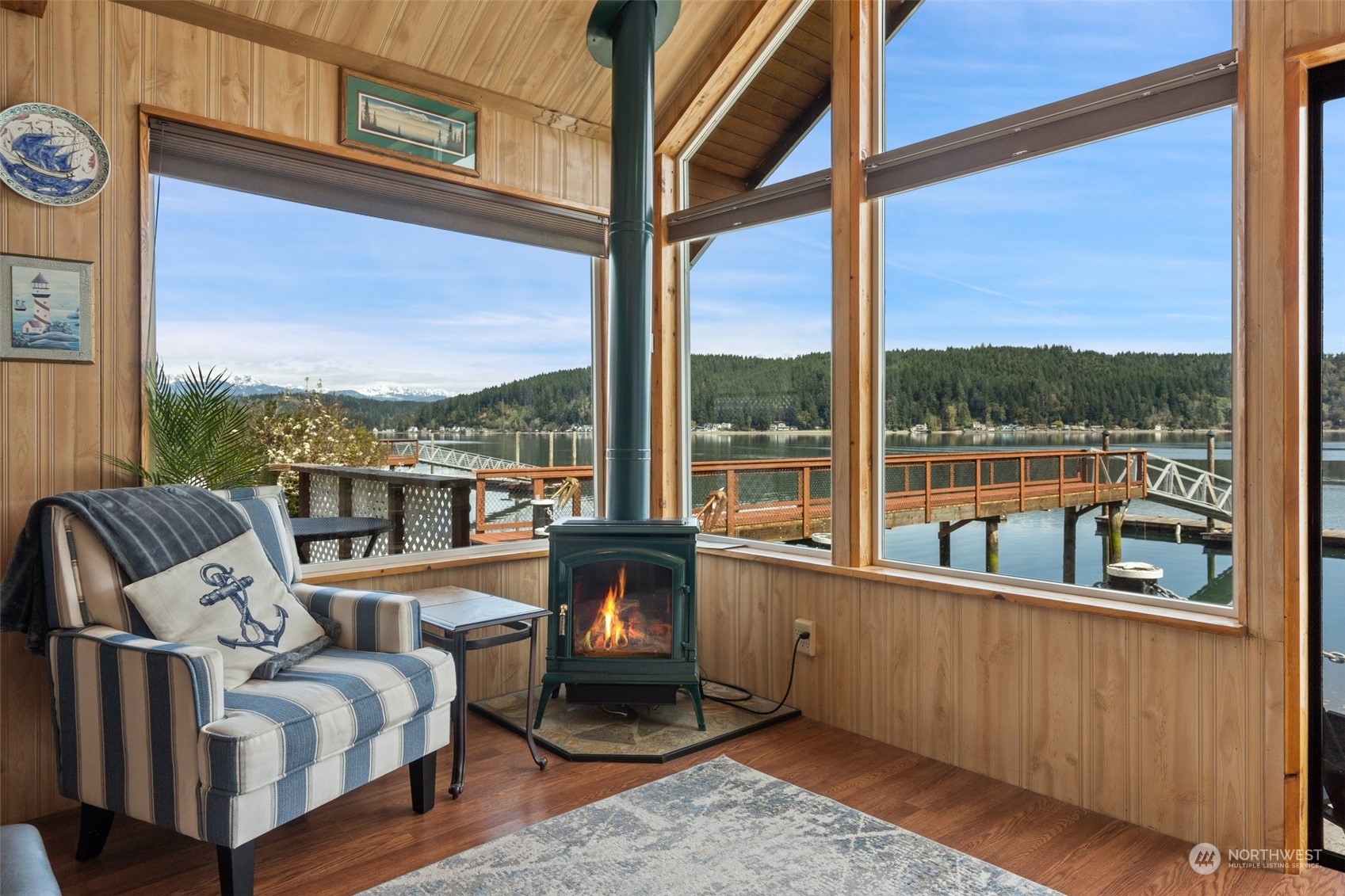 8371 Highway 106 Union, WA 98592 - Photo 4 of 29 a living room with furniture floor to ceiling window and outdoor view