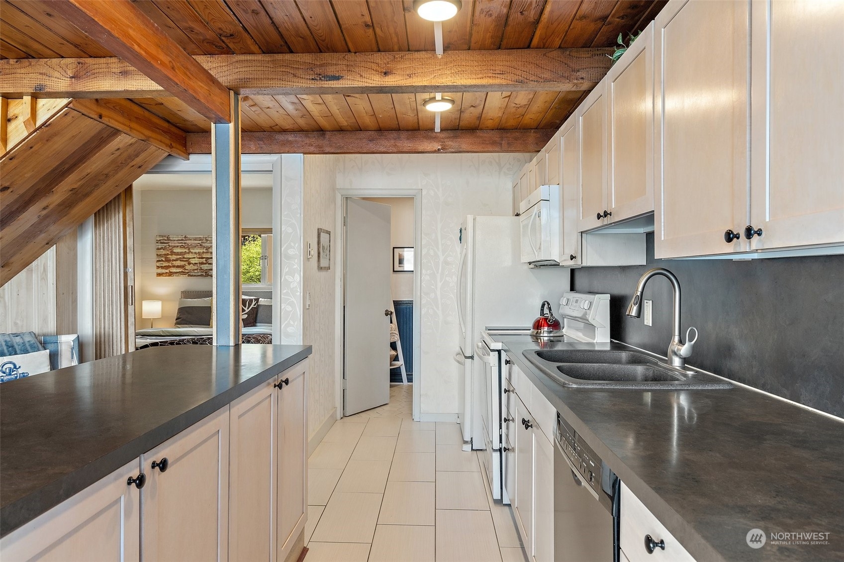 8371 Highway 106 Union, WA 98592 - Photo 5 of 29 a kitchen with stainless steel appliances granite countertop a sink a stove and cabinets