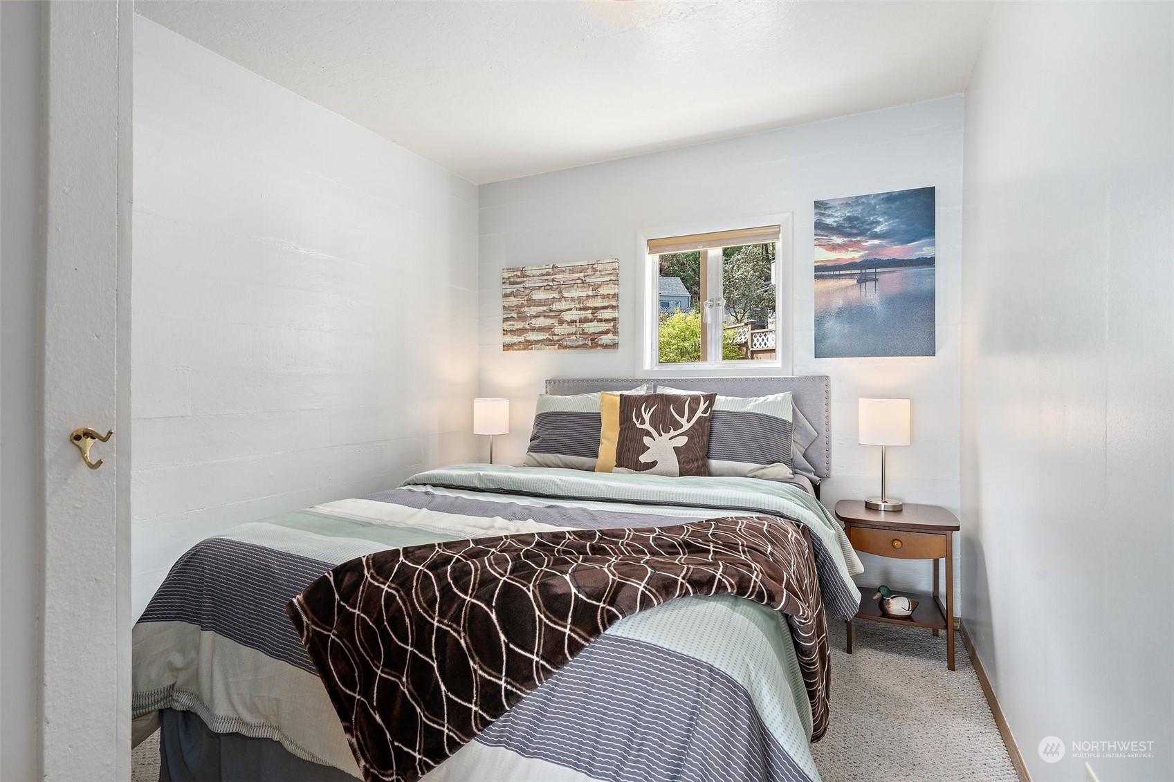 8371 Highway 106 Union, WA 98592 - Photo 7 of 29 a bedroom with a bed and a window