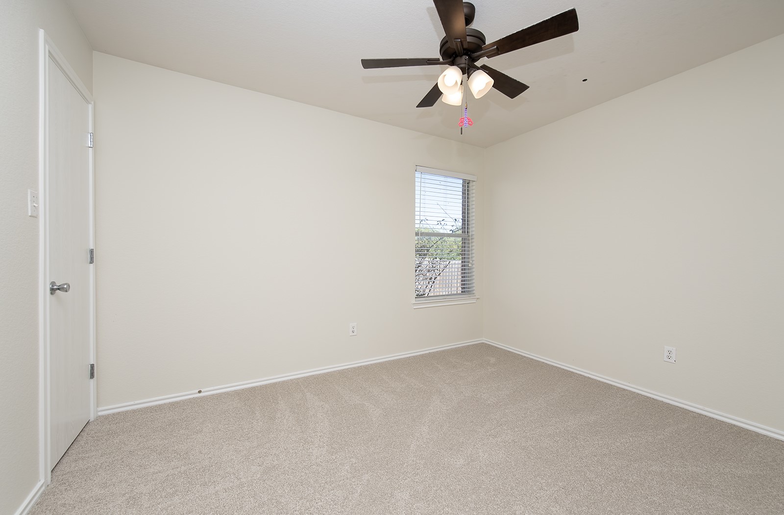 1004 Bluff Meadow Cove Georgetown, TX 78626 - Photo 20 of 26 an empty room with a window and a fan