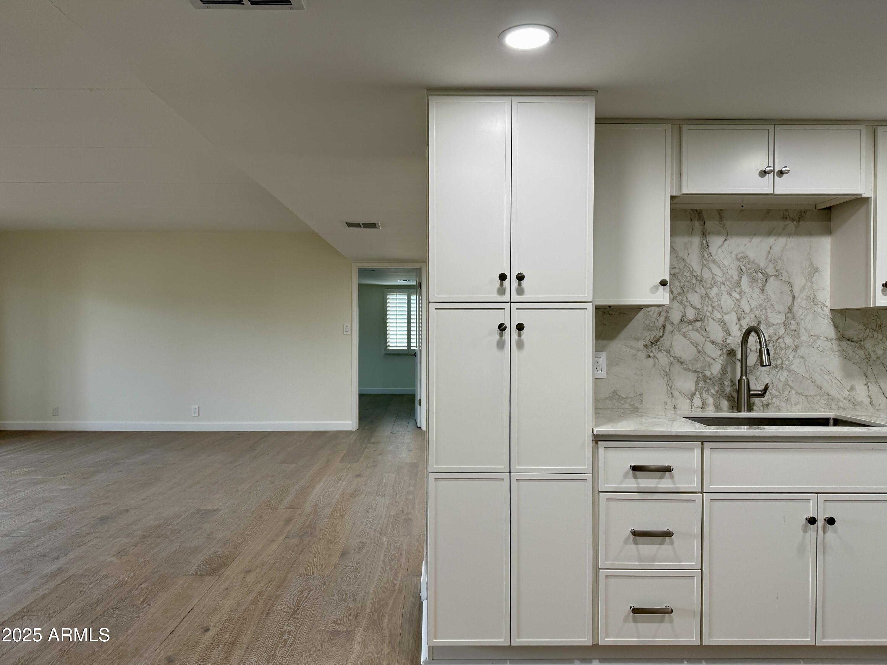 7930 East Camelback Road, Unit 709 Scottsdale, AZ 85251 - Photo 12 of 41 a view of kitchen with wooden floor