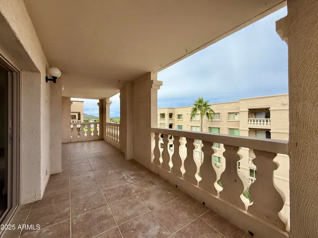 a view of a building with a garden