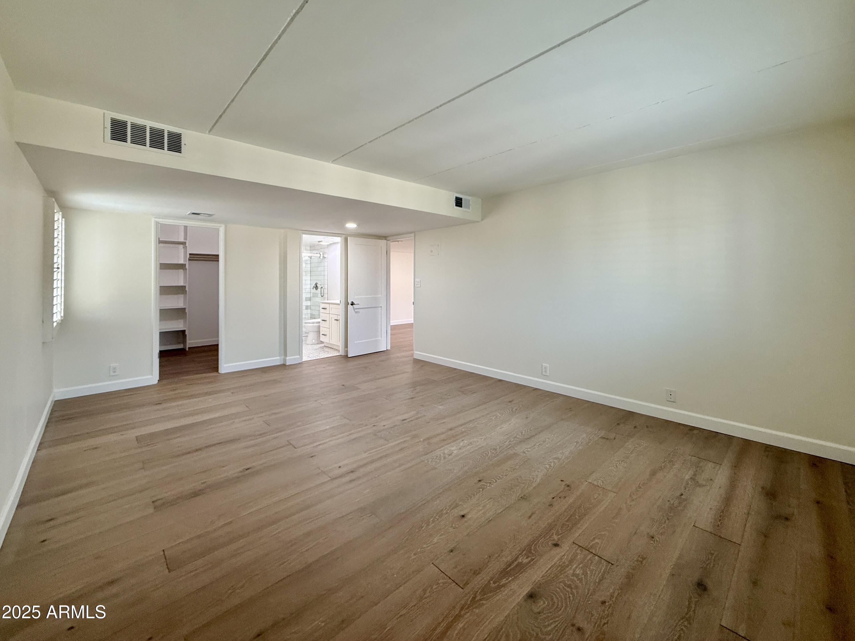 7930 East Camelback Road, Unit 709 Scottsdale, AZ 85251 - Photo 21 of 41 wooden floor in an empty room