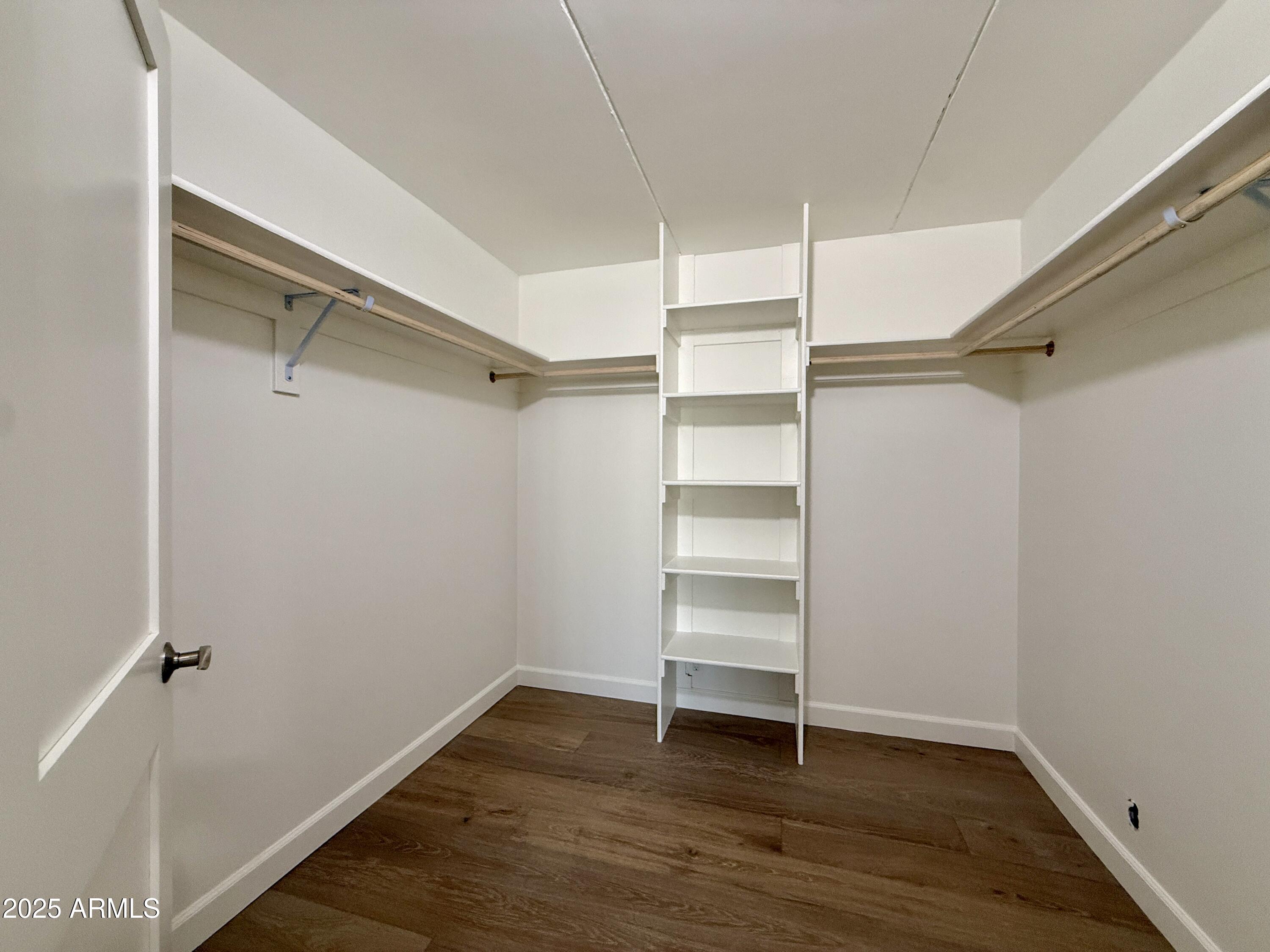 7930 East Camelback Road, Unit 709 Scottsdale, AZ 85251 - Photo 23 of 41 a view of walk in closet with empty racks