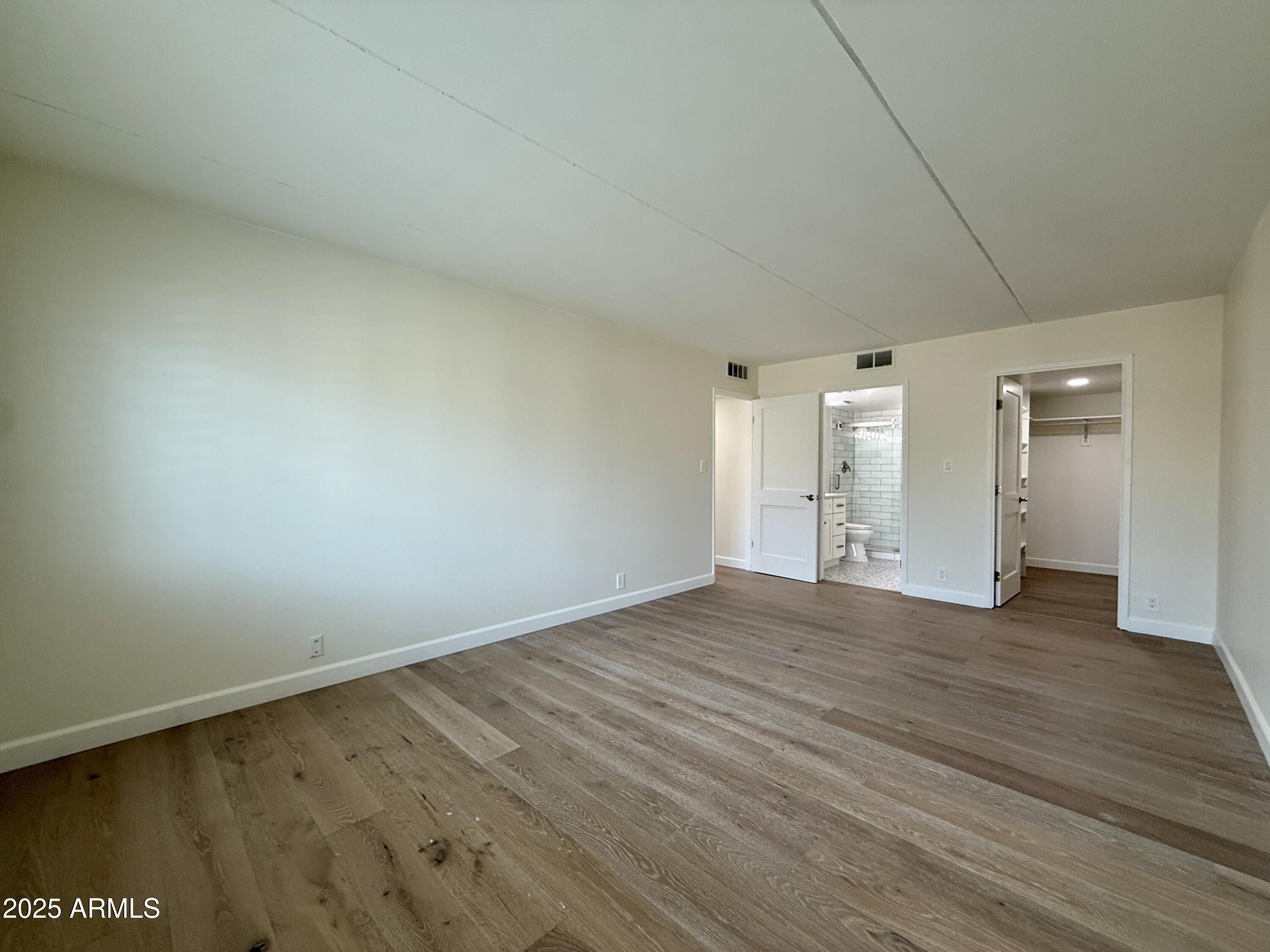 7930 East Camelback Road, Unit 709 Scottsdale, AZ 85251 - Photo 28 of 41 a view of empty room with wooden floor