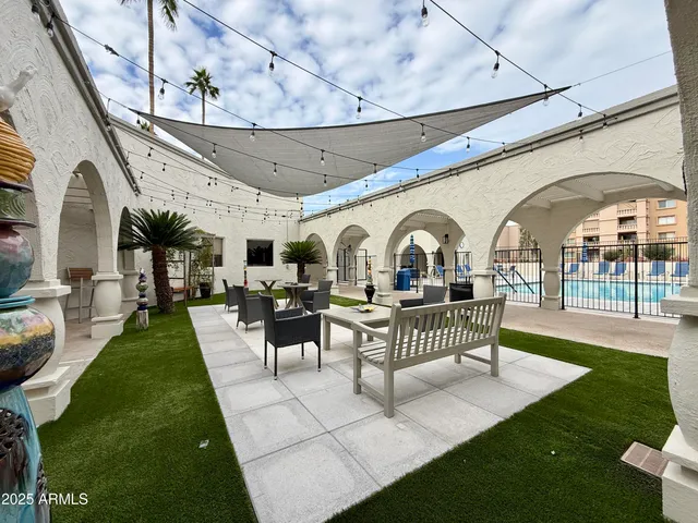 a work room with furniture and a flat screen tv