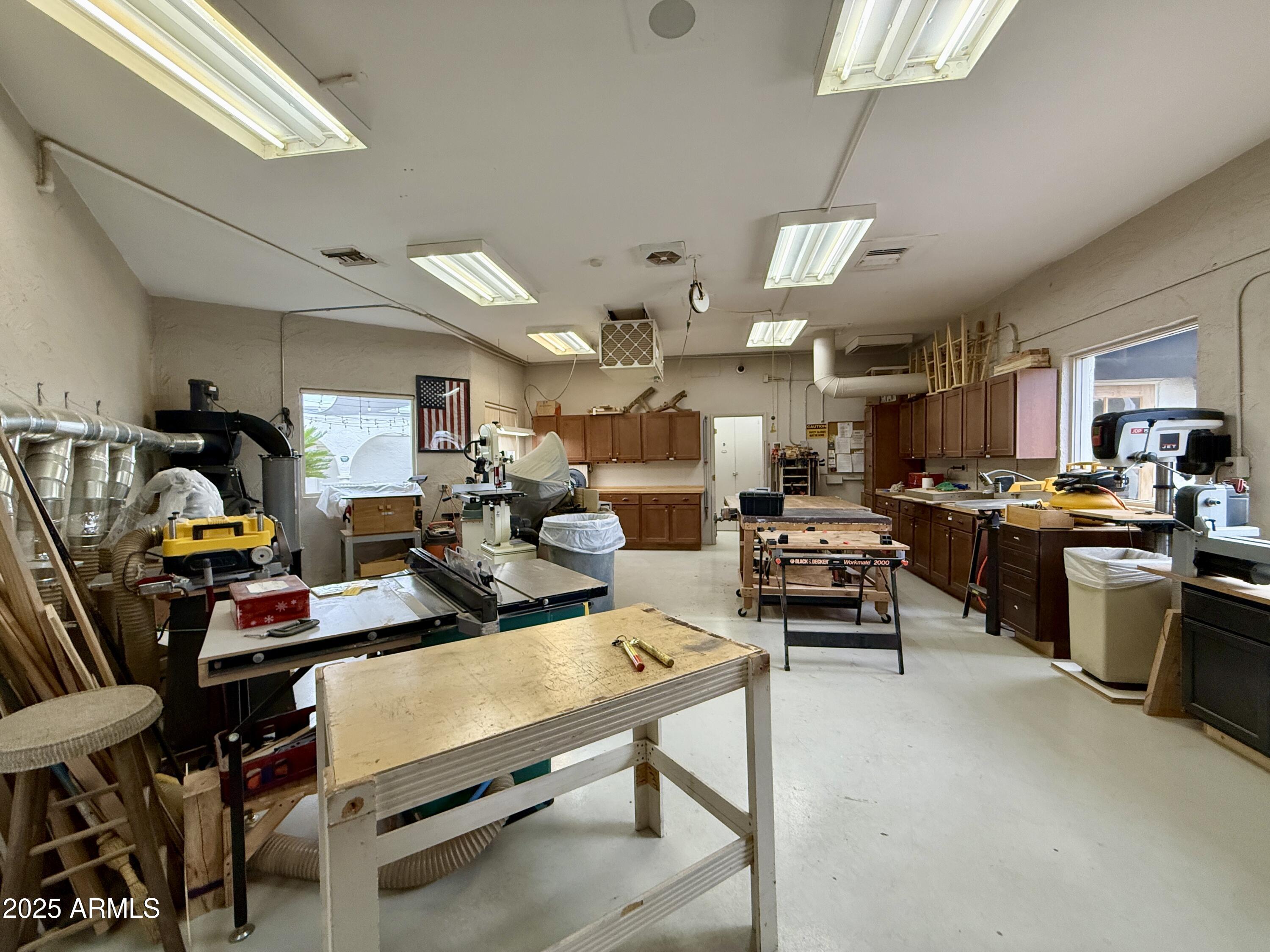 7930 East Camelback Road, Unit 709 Scottsdale, AZ 85251 - Photo 39 of 41 a living room with lots of furniture and kitchen view