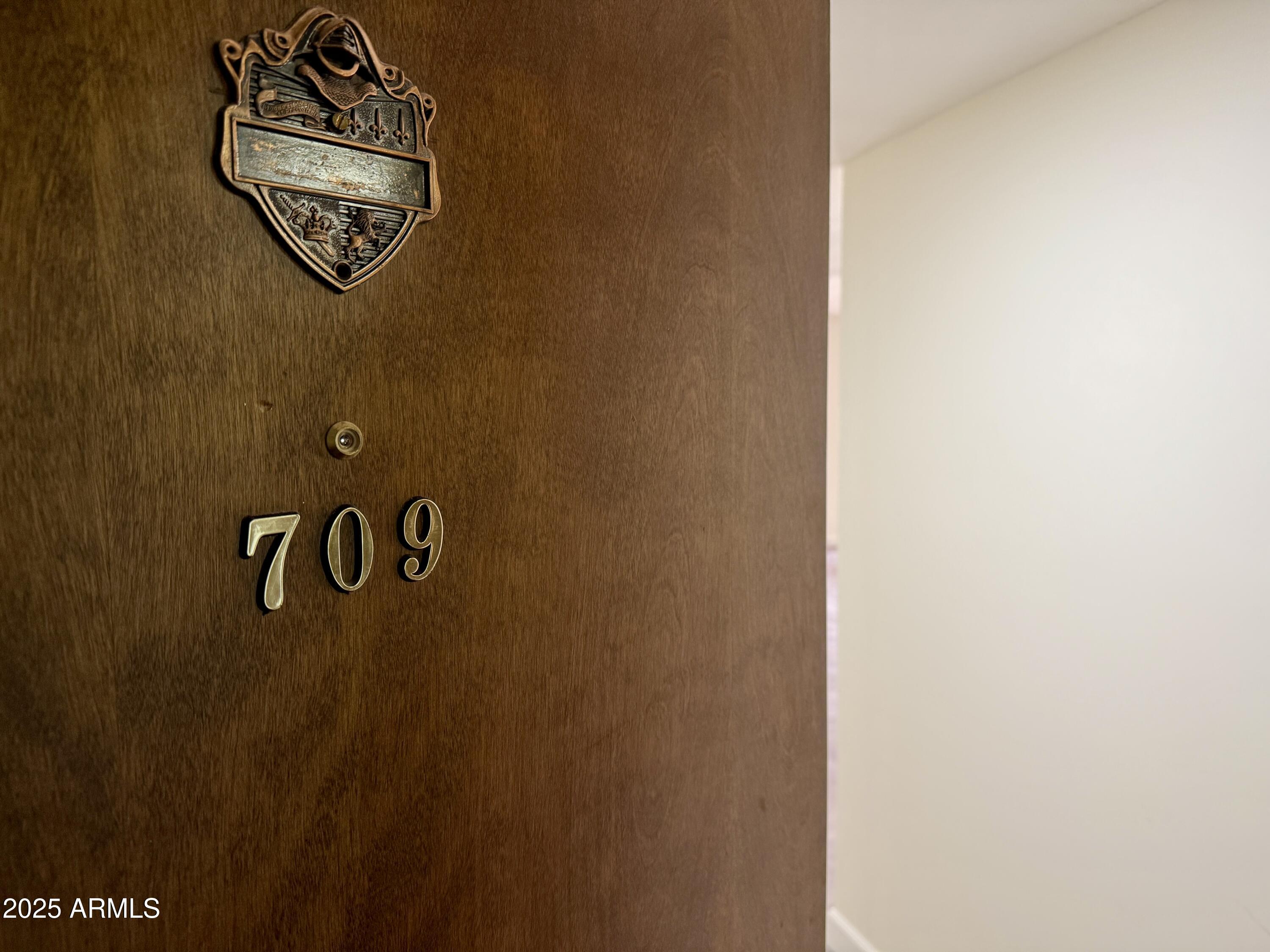 7930 East Camelback Road, Unit 709 Scottsdale, AZ 85251 - Photo 4 of 41 a close up of a wall with a sign on it