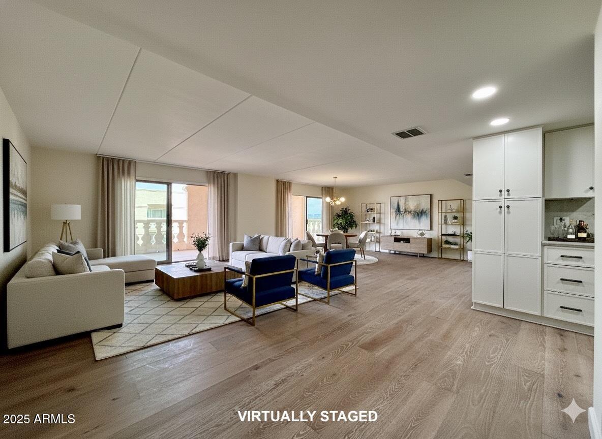 7930 East Camelback Road, Unit 709 Scottsdale, AZ 85251 - Photo 5 of 41 a living room with furniture and a flat screen tv