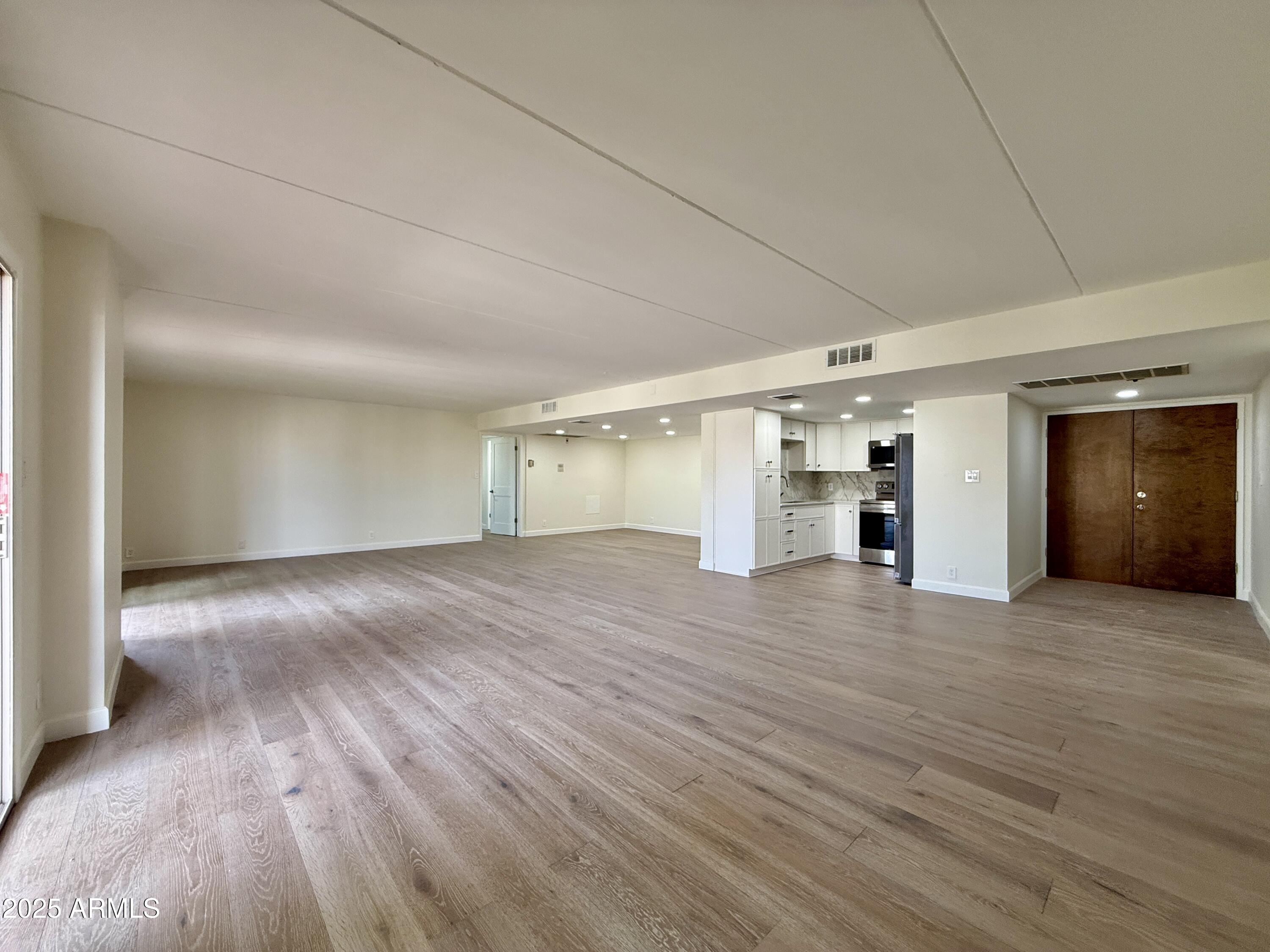 7930 East Camelback Road, Unit 709 Scottsdale, AZ 85251 - Photo 8 of 41 a view of empty room with wooden floor