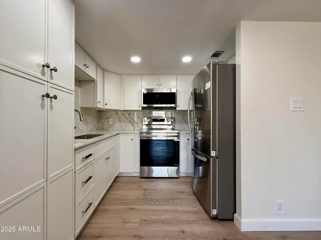 a view of kitchen with wooden floor