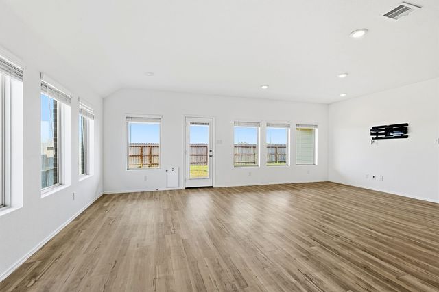 a kitchen with stainless steel appliances a sink stove and cabinets